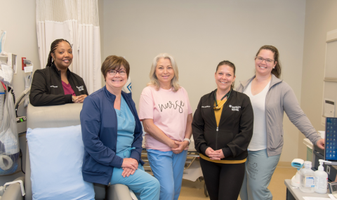 Photo from left to right: Halona Scott, RN, Colleen Parfrey-Roefs, RN, Cyndi Hoath, RN, Deanne Mulcahy, Nurse Practitioner, and Kim Shantz, Nurse Practitioner ready to support patients in the Systemic Therapy and Assessment Clinic in the Verspeeten Family Cancer Centre. 