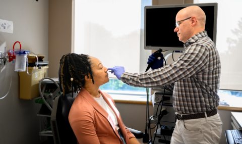 Dr. Rotenberg examining a patient.
