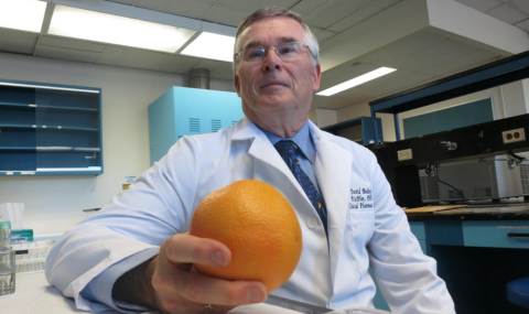 The late Dr. David Bailey holding a grapefruit in 2017 