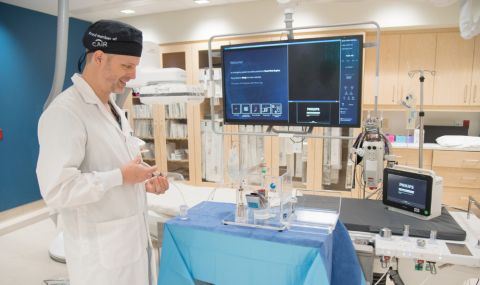 Dr. Derek Cool, Associate Scientist at London Health Sciences Centre Research Institute (LHSCRI) and Interventional Radiologist at London Health Sciences Centre (LHSC), demonstrating the equipment used to deliver radioactive beads to treat patients with kidney cancer.