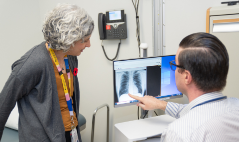 Nurse Practitioners Sari Belzycki and Matthew Parezanovic review a lung X-ray.