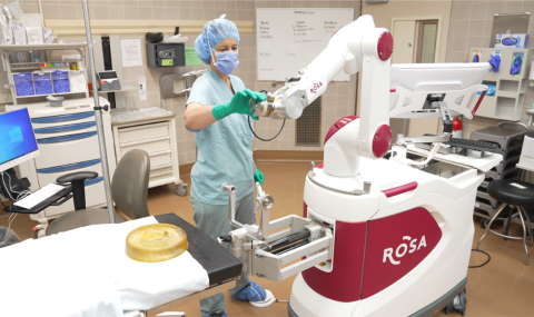 Dr. Sandrine de Ribaupierre Associate Scientist at LHSCRI and Paediatric Epilepsy Neurosurgeon, demonstrates the ROSA Robotic Arm. Dr. de Ribaupierre, in collaboration with the University Hospital Epilepsy Program at LHSC, including Dr. Jonathan Lau, performed the Canadian First Radiofrequency Thermocoagulation procedure on 11-year-old Makayla Douglass