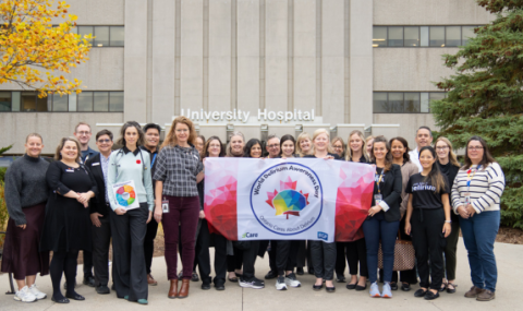 A group of staff are pictured with the Ontario delirium flag