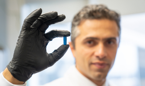 Saman Maleki, PhD, holding a ‘poop pill’ developed by Lawson Research Institute (Lawson) of St. Joseph’s Health Care London and tested in clinical trials at London Health Sciences Centre Research Institute and Centre de recherche du Centre hospitalier de l’Université de Montréal (CRCHUM)