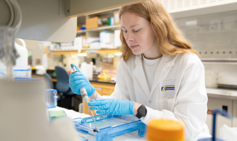 Frederikke Larsen completes a task with a pipette in the LHSCRI labs. 