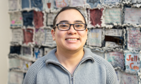 Christopher Keel, patient, in front of the jean quilt at the Adult Eating Disorders Service, LHSC