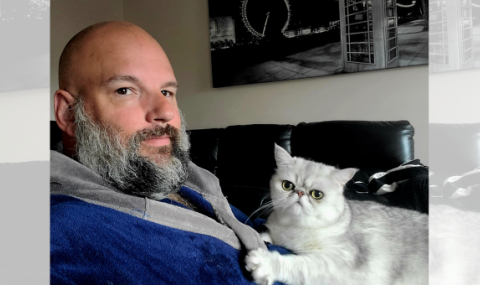 Kevin Beaulieu is pictured with his “emotional support cat” Maximus