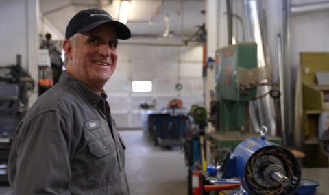 Walter smiles in the machine shop.