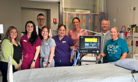 Members of the CCU are pictured by the bedside of a new level 3 critical care patient room
