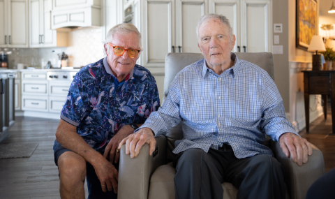 Ken and Craig sitting beside one another.