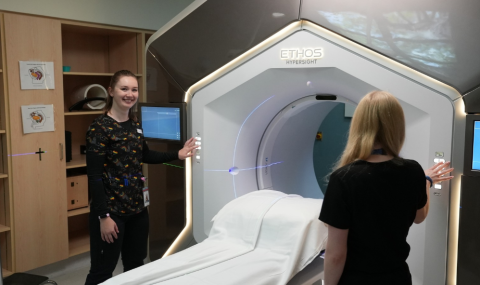 Photo from left: Meghan Koczwara and Christine Rossi, radiation therapists in the Verspeeten Family Cancer Centre preparing the Ethos linear accelerator (used to deliver radiation therapy) for a patient. 