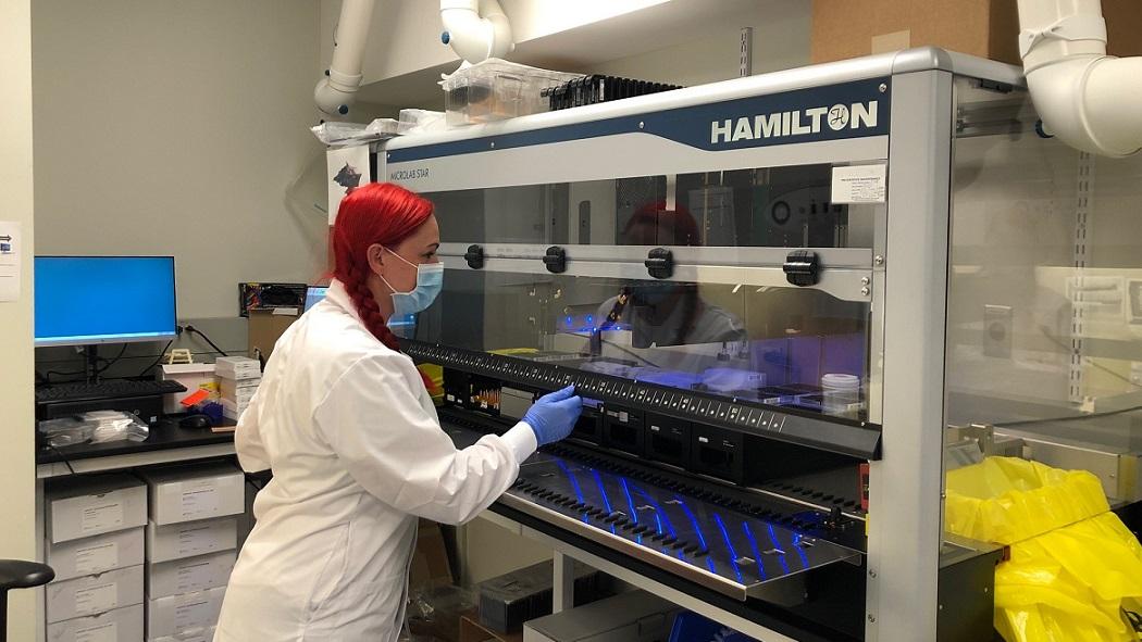 Roxanne Wan, Medical Laboratory Assistant, Key Operator at LHSC is working on the newly purchased STAR (Liquid Handler/Extractor) nicknamed “Axiom”