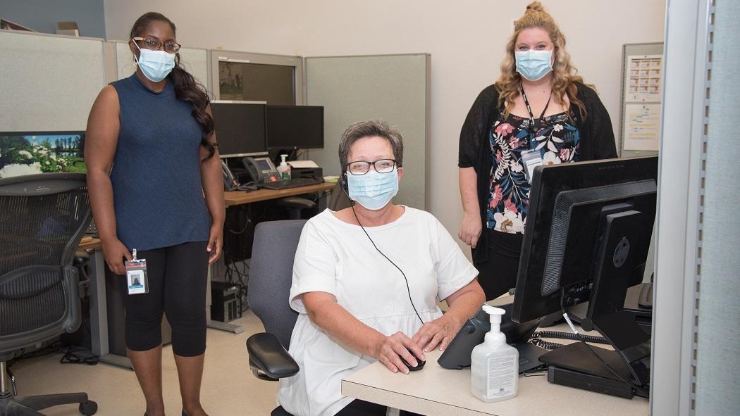 Operators Kate Beavon and Brittany Thompson work in Switchboard along with forms designer Jasmine John to provide support to patients, families and staff.