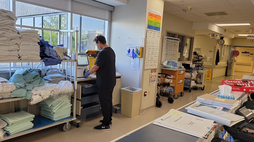 Registered Respiratory Therapist, Christopher Ptak runs blood gases to determine ventilation strategies for patients