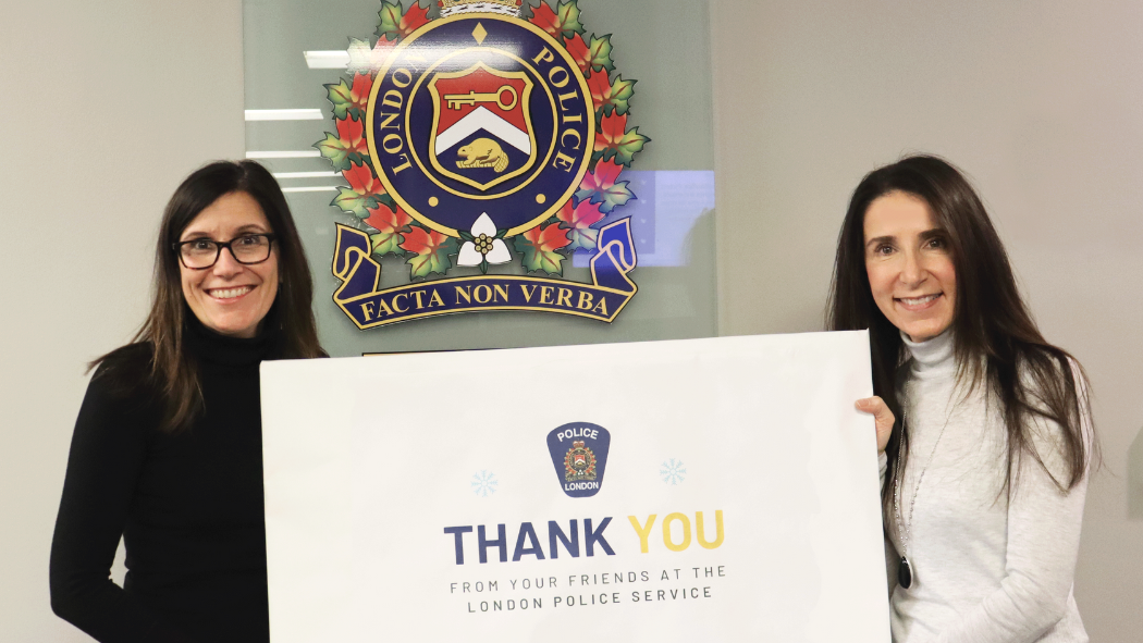 Image of the London Police Service holding a sign to thank Emergency Department partners