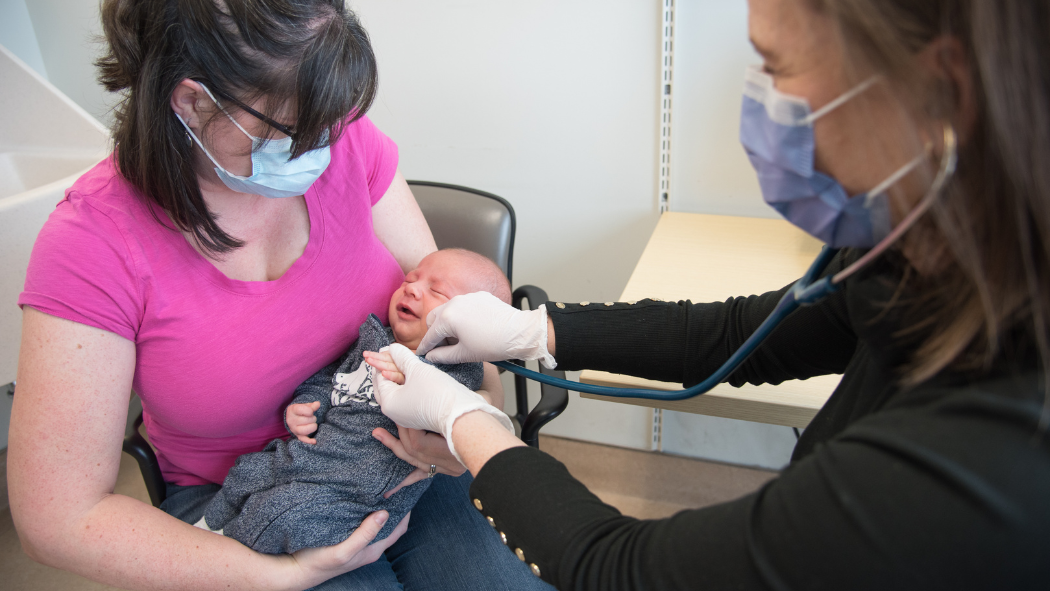 Allison and baby Sawyer Zietsma, centre, pictured with midwife Lauren Columbus