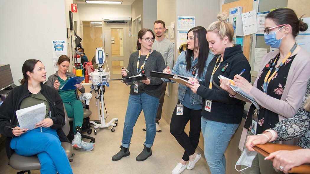 Staff gathered at a bullet round