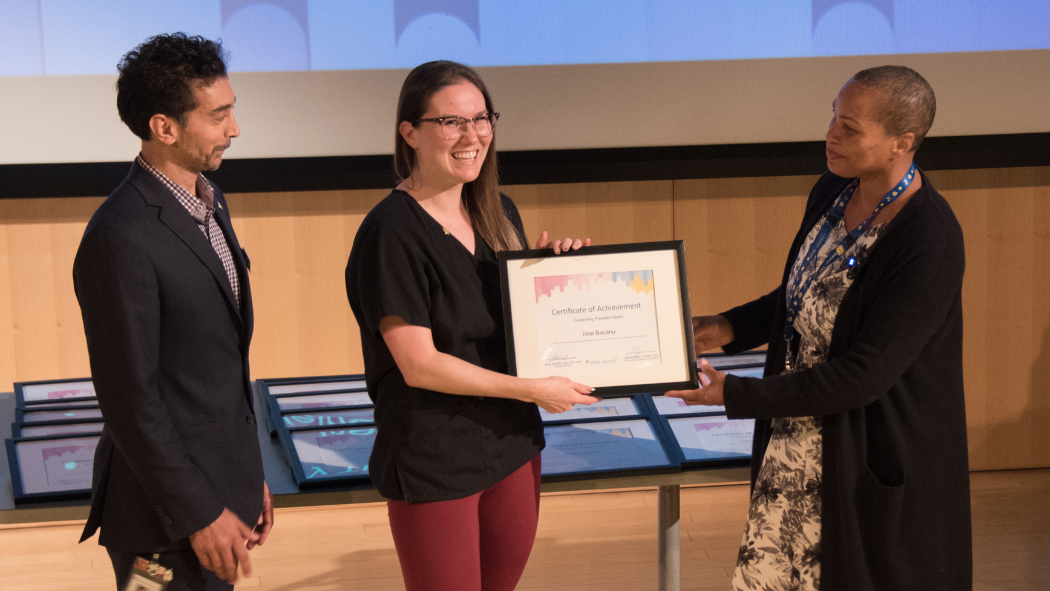 LHSC President & CEO Jackie Schleifer Taylor and Corporate Academic Executive Jatinder Bains presenting an award to Irina Bacanu