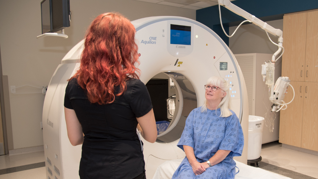 MRT technician speaking with patient