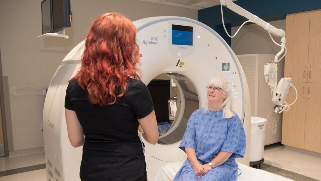 MRT technician speaking with patient 