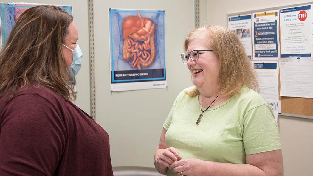 Heather McKinlay (left), a social worker with the Bariatric Centre of Excellence, talks with Sandy Achilleos (right), a member of the centre’s support group.