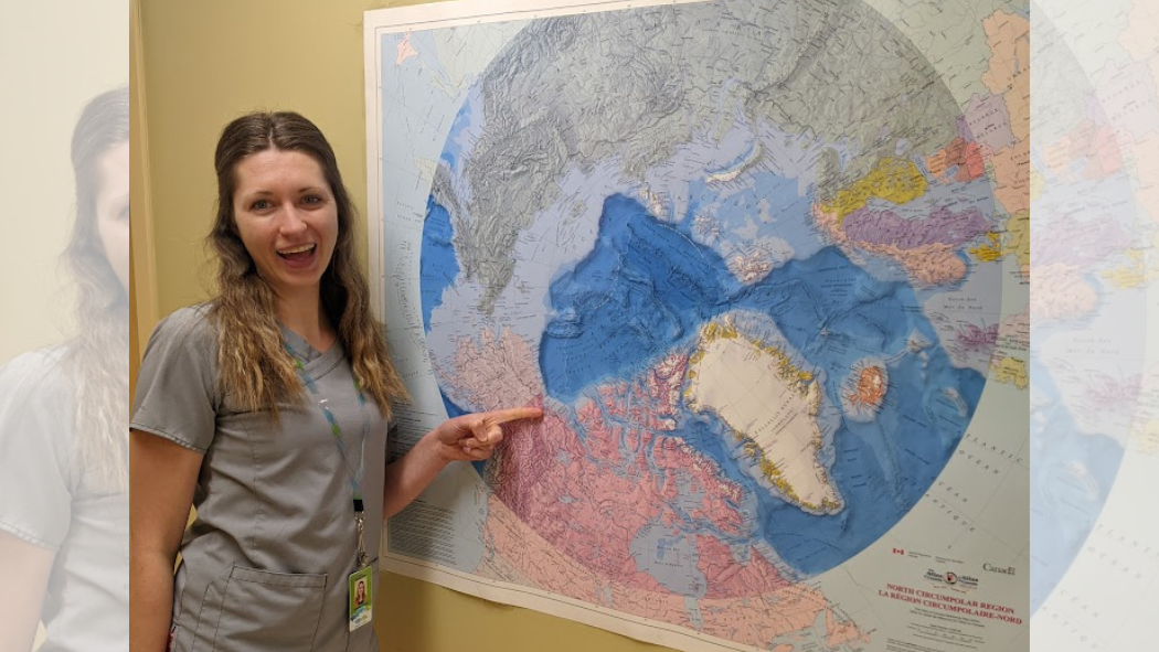 Woman points to Inuvik on map