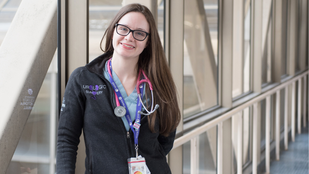 Dr. Victoria Turnbull, a resident at LHSC, stands in a hospital hallway