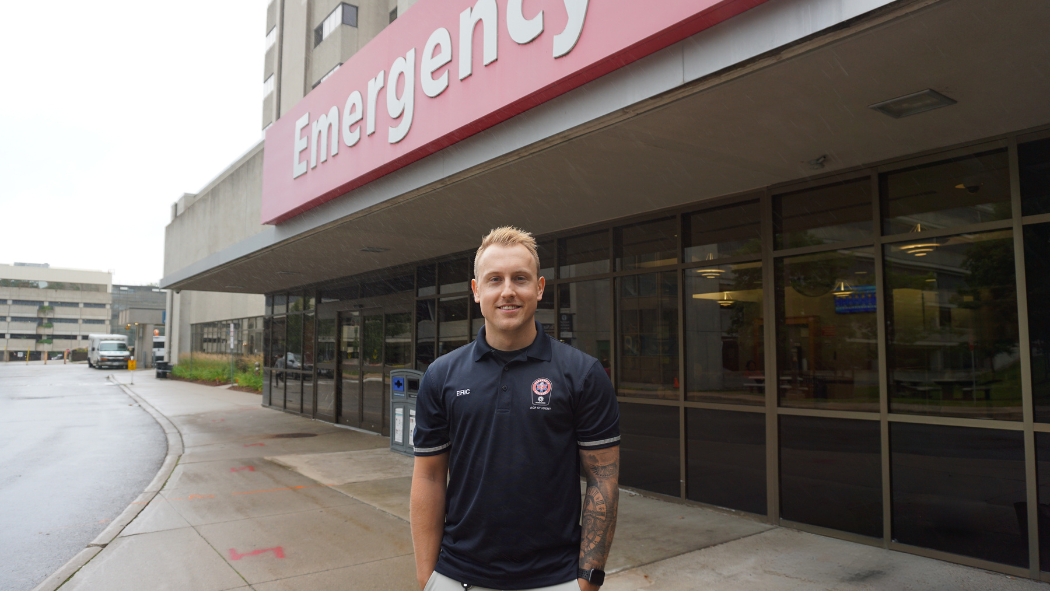 Paramedic Eric Hocking stands in front of the entrance to the Emergency Department at University Hospital