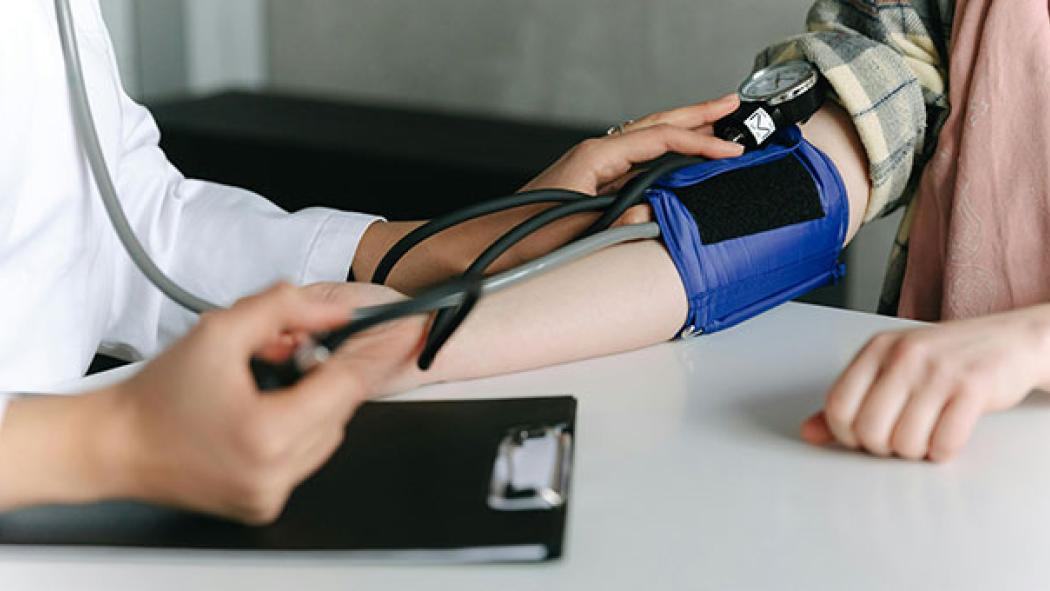 Doctor taking blood pressure