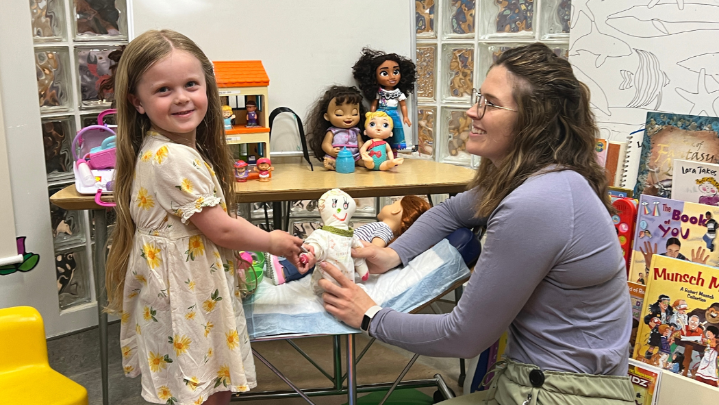 Patient Isla Gerster with Child Life Specialist Bailey Felkar