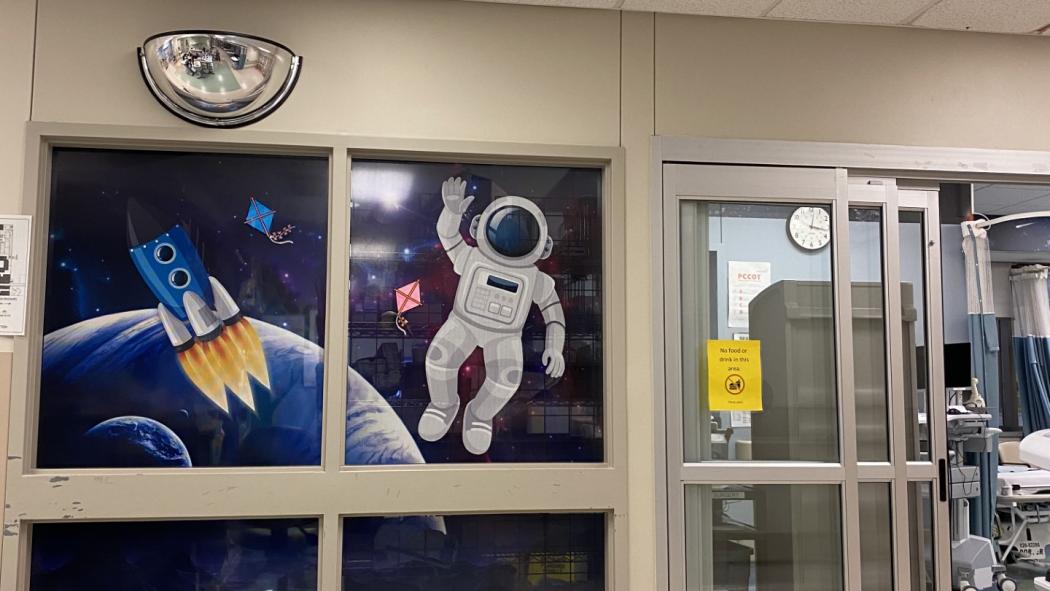 Astronaut near patient beds