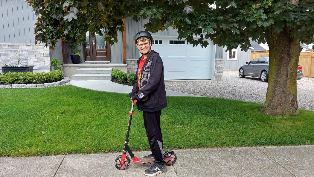 Noah Batson on scooter