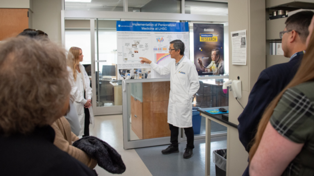 Dr. Kim showcasing research poster