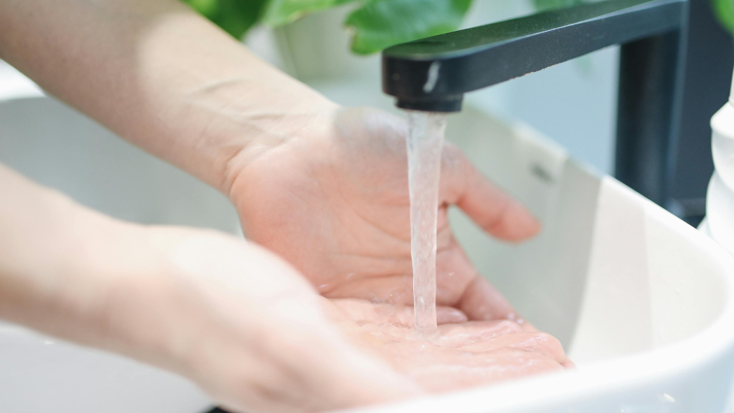 Washing hands in sink