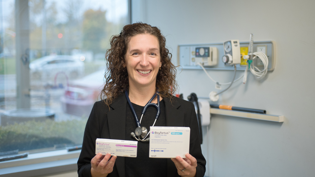 Erin Fleischer holding boxes of medication