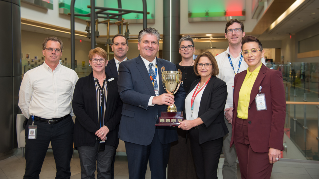From left to right: Jeff Kinney, Sue Milburn, Jerry Plastino, David Musyj, Jade Bolsover, Marisa Gatfield, Alex Tyml, and Tania Testa celebrate LHSC’s first-place award in the 2024 Canadian Blood Services Hospital Challenge.