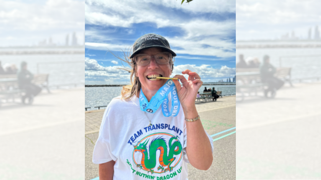 Transplant recipient Kathleen Zavarise celebrates a gold medal Dragon Boat race win