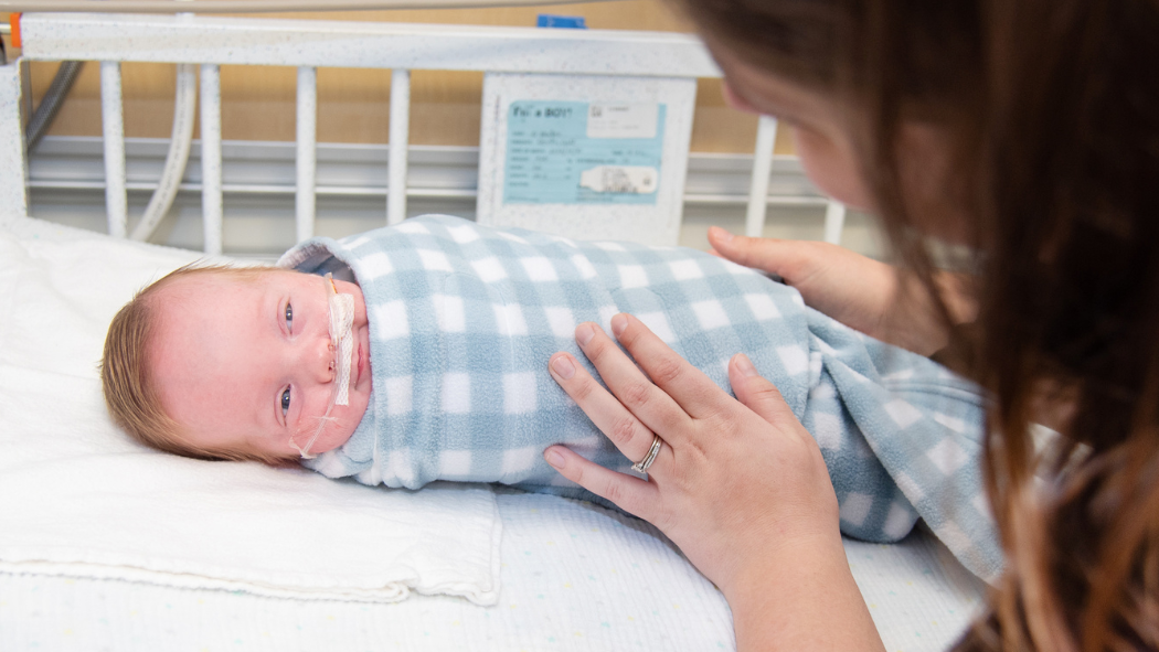 Baby wearing a sleep sack in the NICU