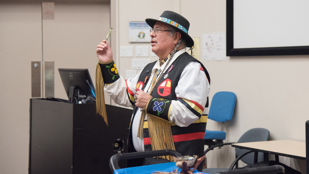 Elder Myeengun Henry, a member of LHSC's Visiting Elders Program, demonstrates how smudging ceremonies can help Indigenous patients heal