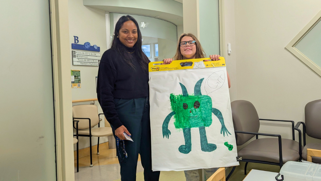 Dr. Abi Kandasamy with Charlotte Sangers and her pain monster