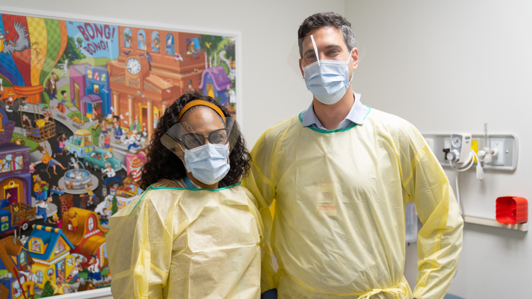 Dr. Michelle Barton-Forbes and Dr. Nadim Khalil in their personal protective equipment.