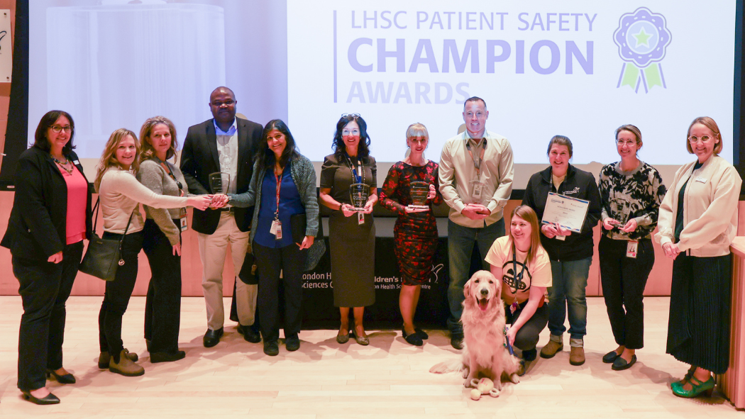 Award recipients stand facing camera smiling