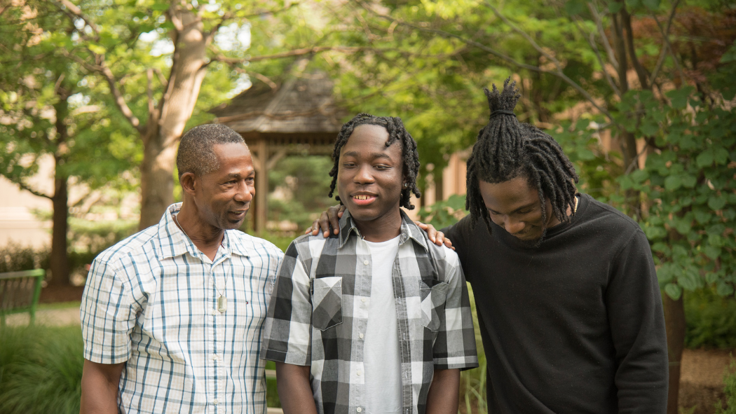 From left: Deron Halstead (Jahmari’s father), Jahmari Halstead and Jahvaughn Halstead (Jahmari’s brother) in the cancer garden at Victoria Hospital