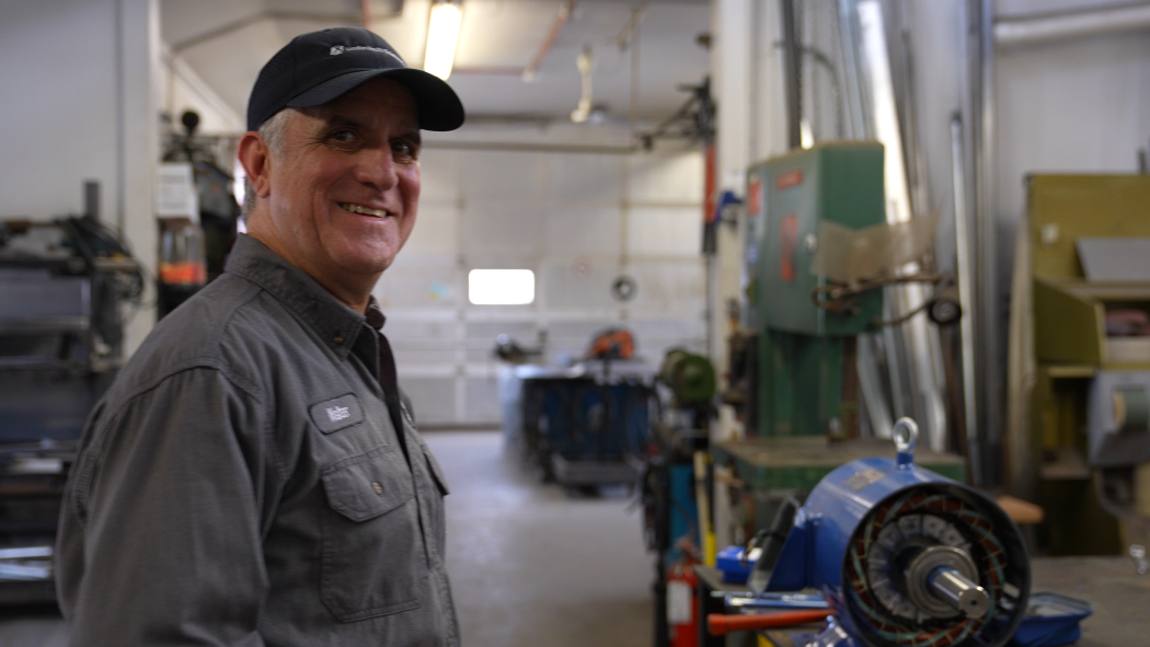 Walter smiles in the machine shop.