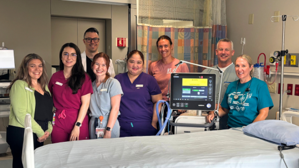 Members of the CCU are pictured by the bedside of a new level 3 critical care patient room