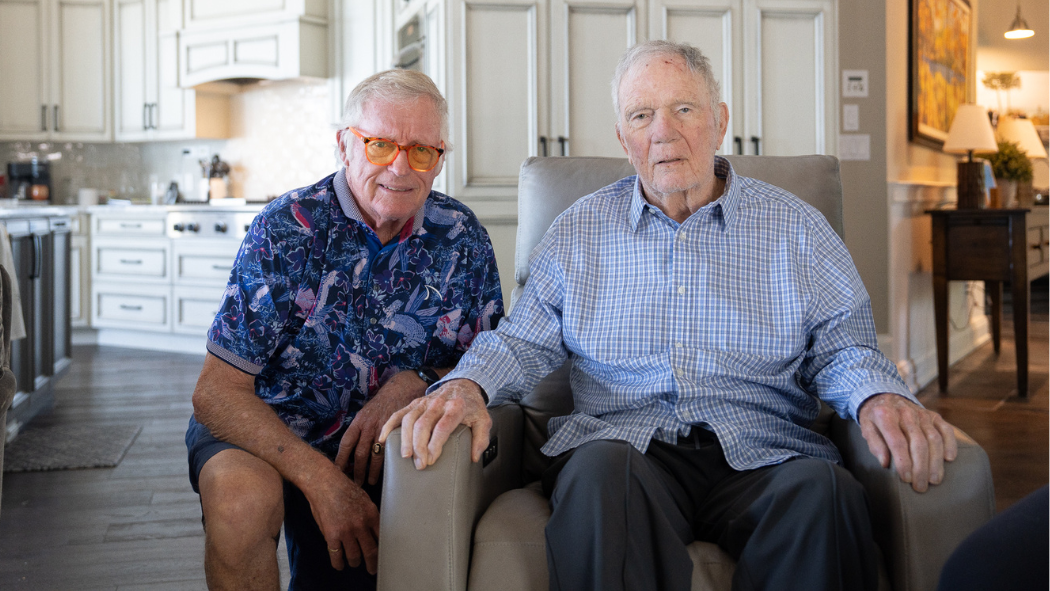 Ken and Craig sitting beside one another.