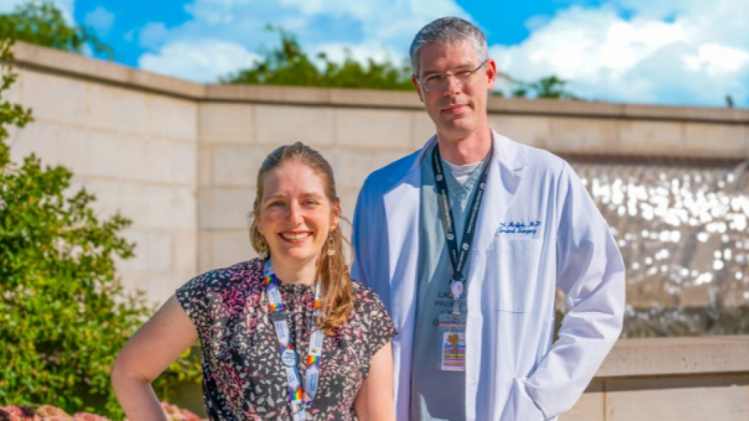 Doctors Rachel Kyle and Brad Moffat are pictured outside of Parkwood Institute in front of a water feature on a sunny day