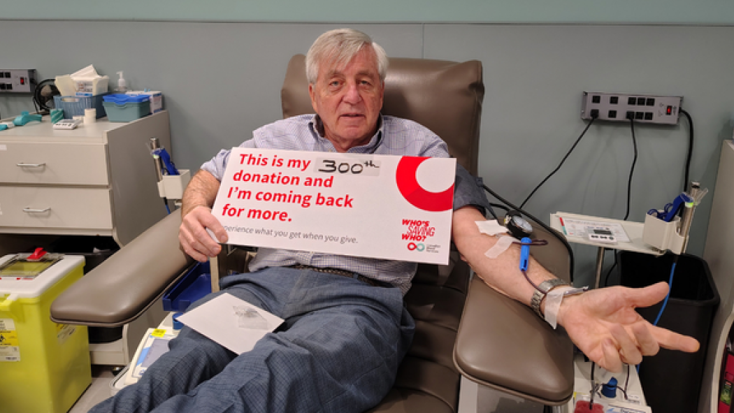 Glen Dietz, Laboratory Quality Consultant at LHSC, sits proudly completing his 300th donation with Canadian Blood Services. He holds a sign that says, “This is my 300th donation and I’m coming back for more.”